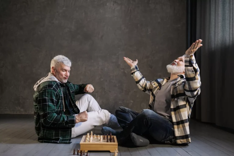elderly men playing chess